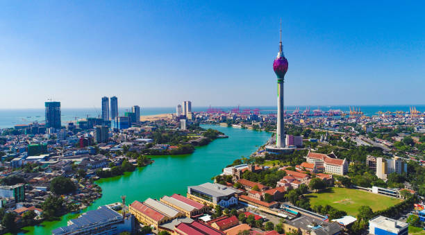 The skyline of Kuala Lumpur, Malaysia, featuring modern skyscrapers and lush greenery in a bustling city setting.